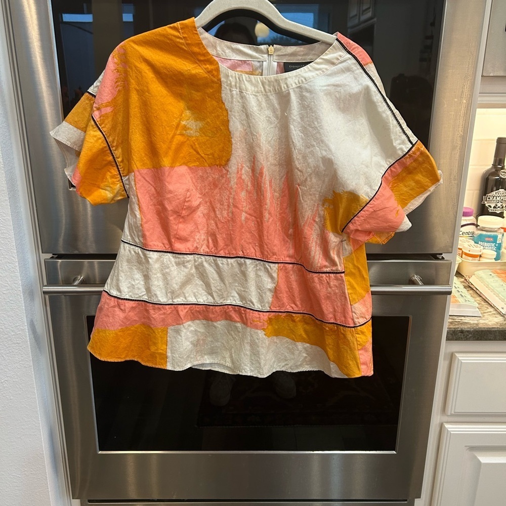 Donna Karan city art blocks Blouse size S has small snag GUC